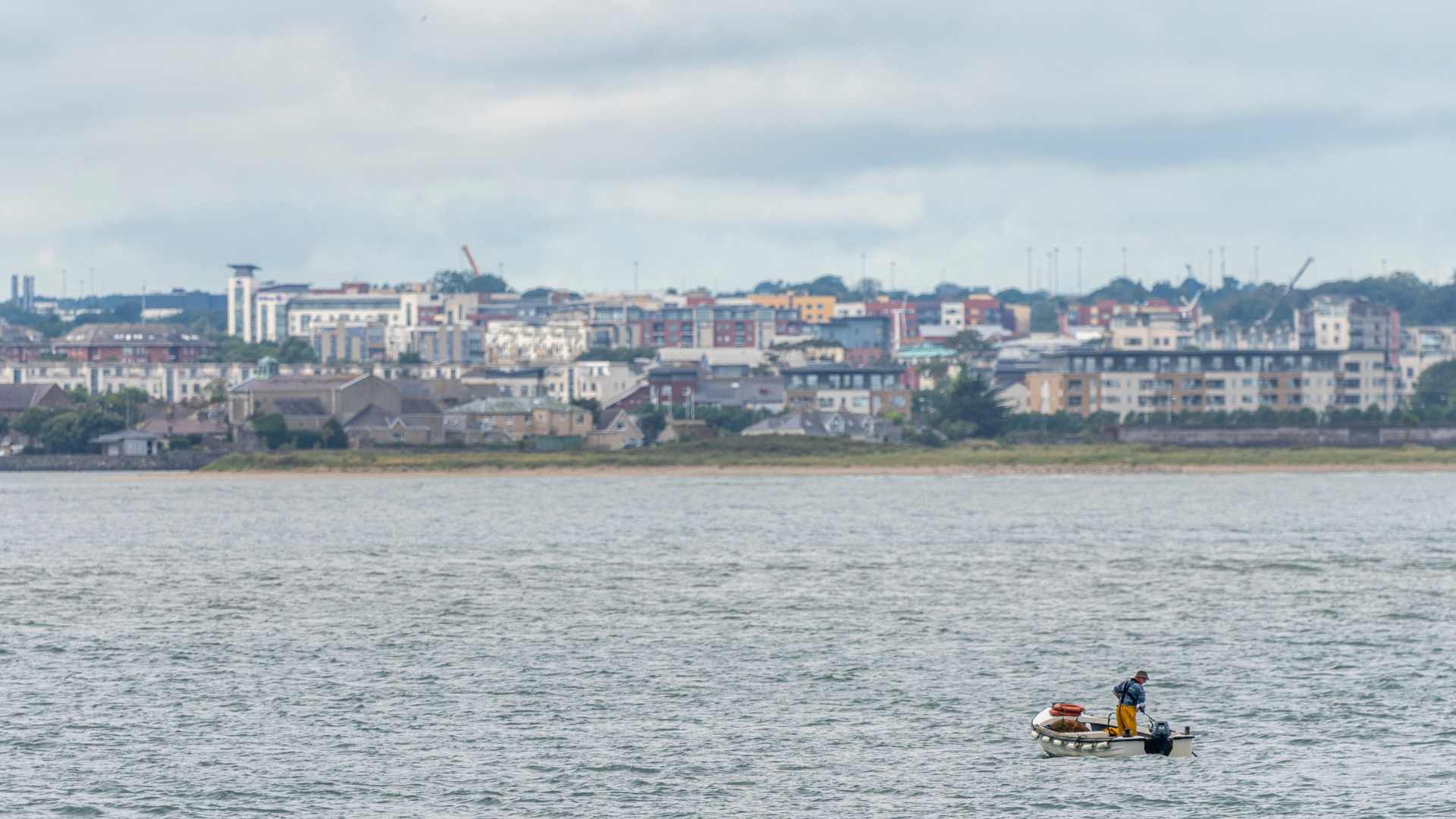 A small fishing boat leaving the Port of Howth, Dublin