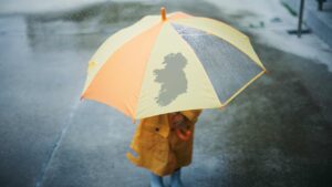 Child with umbrella in rainy weather
