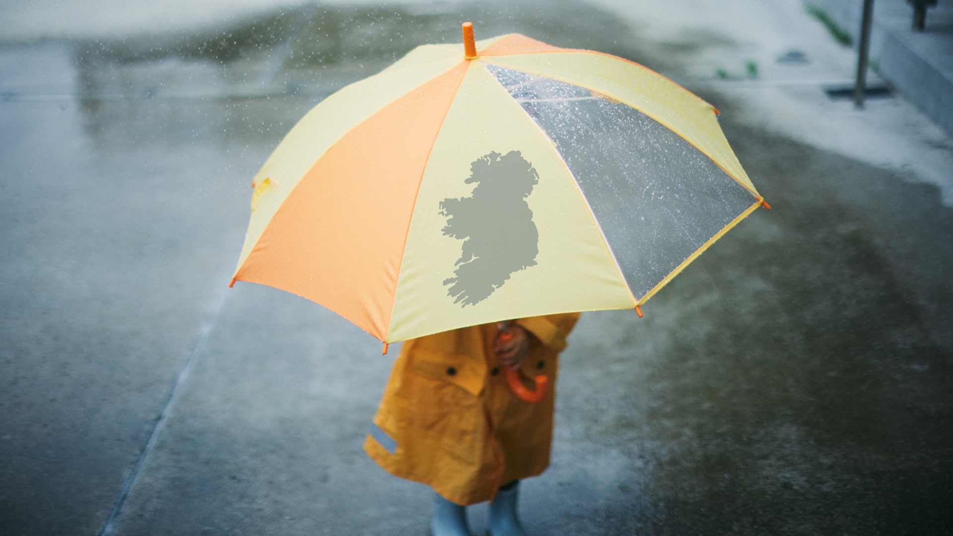 Child with umbrella in rainy weather